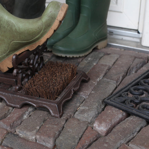 Voetveger met schoenschraper